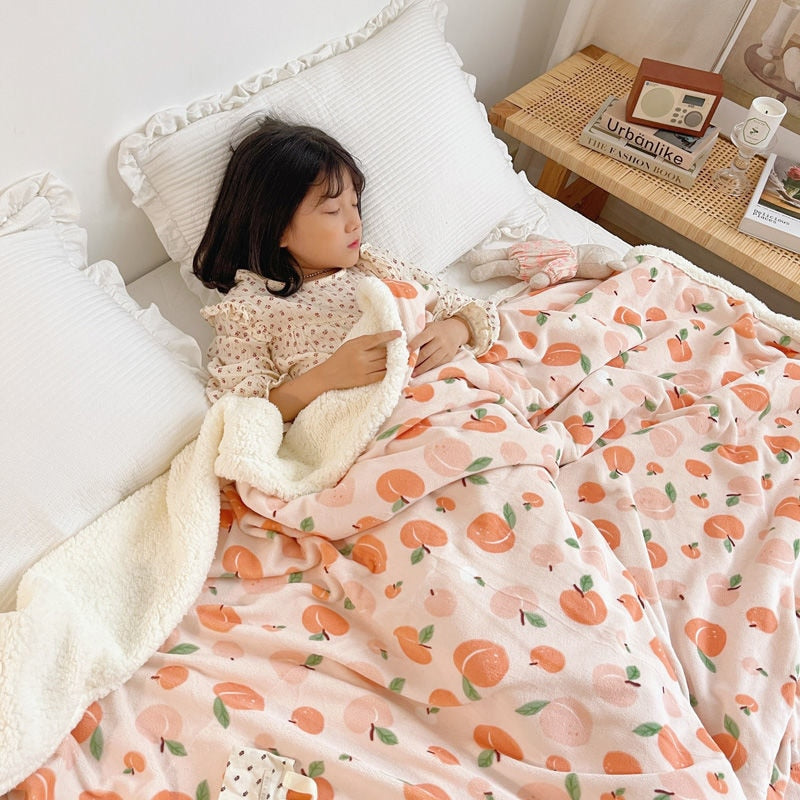 Lamb fleece blanket with peach fruit print and white sherpa border