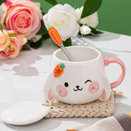 Rabbit ceramic mug with lid and carrot spoon inside, pink handle, bunny face design.