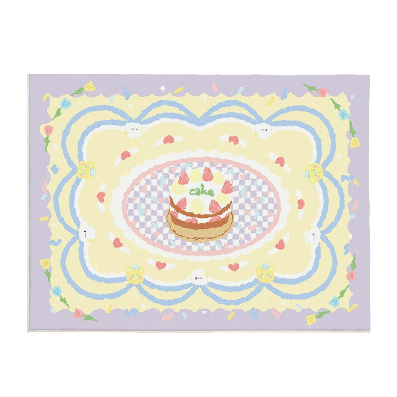 Lilac plush area rug with central cake, rainbow swirls, and cute bunny-face details