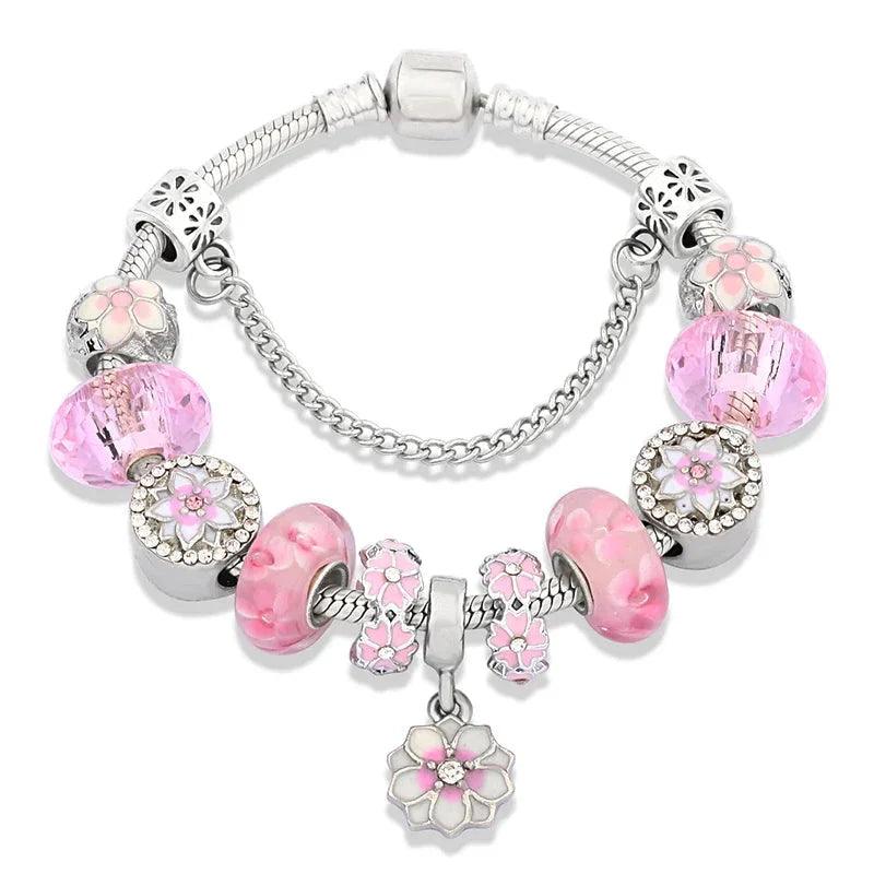 Pink charm bracelet with silver beads, flower and cat charms, central pink glass bead
