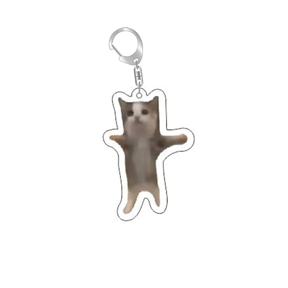 Cat keychain with silver ring and clip; gray cat standing with raised paw.
