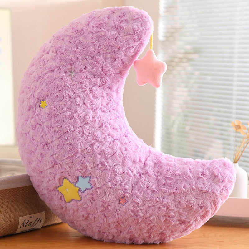 Purple moon plush pillow with pink star patch and embroidered multicolor star details