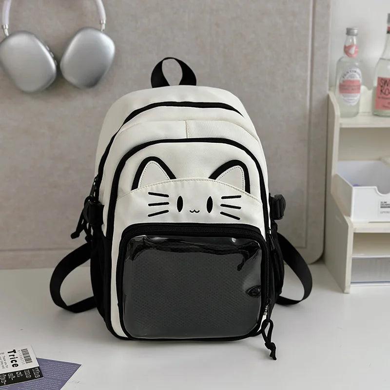Black and cream mini cat-ear school backpack with cat-face patch and mesh front pocket