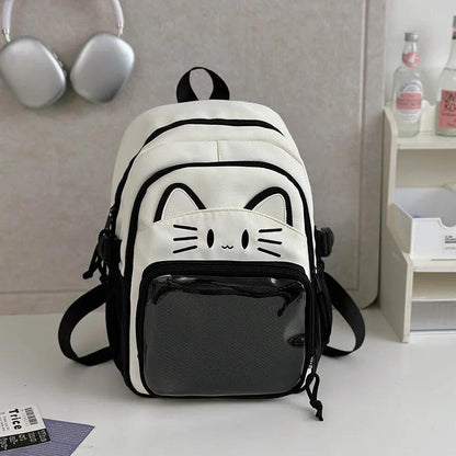 Black and cream mini cat-ear school backpack with cat-face patch and mesh front pocket