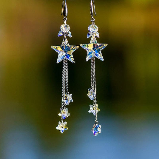 Star dangling earrings with blue and clear crystals on silver chain drops