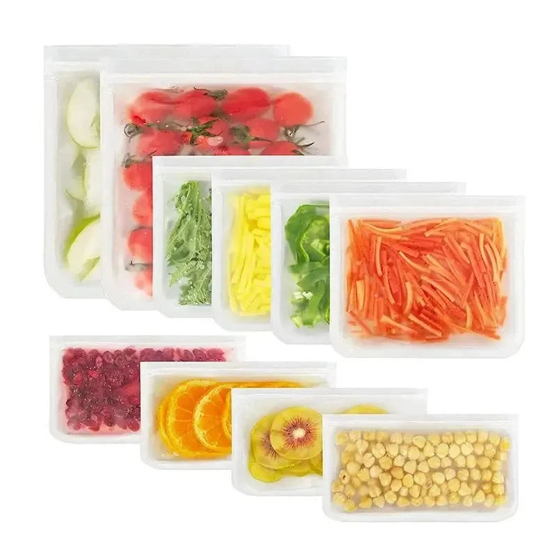 Reusable silicone food storage bag with clear zip top, filled with mixed produce