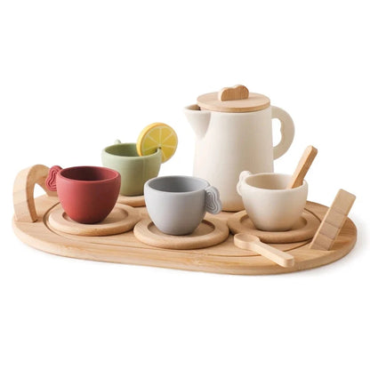 Wooden pretend tea set with white teapot, cups, tray, and wooden spoon pieces