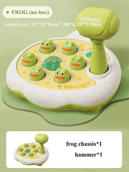 Frog-themed toddler shape hammer toy with green frog pieces on a round base
