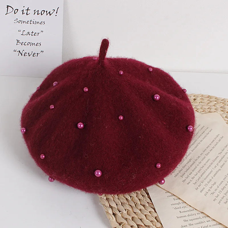 Burgundy felt beret with faux pearl embellishments and pointed top