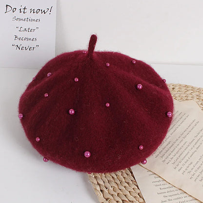 Burgundy felt beret with faux pearl embellishments and pointed top