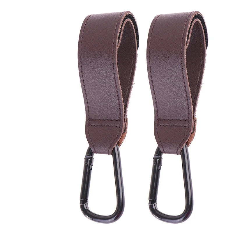 Pair of dark mauve PU stroller bag hanger straps with black metal S hooks