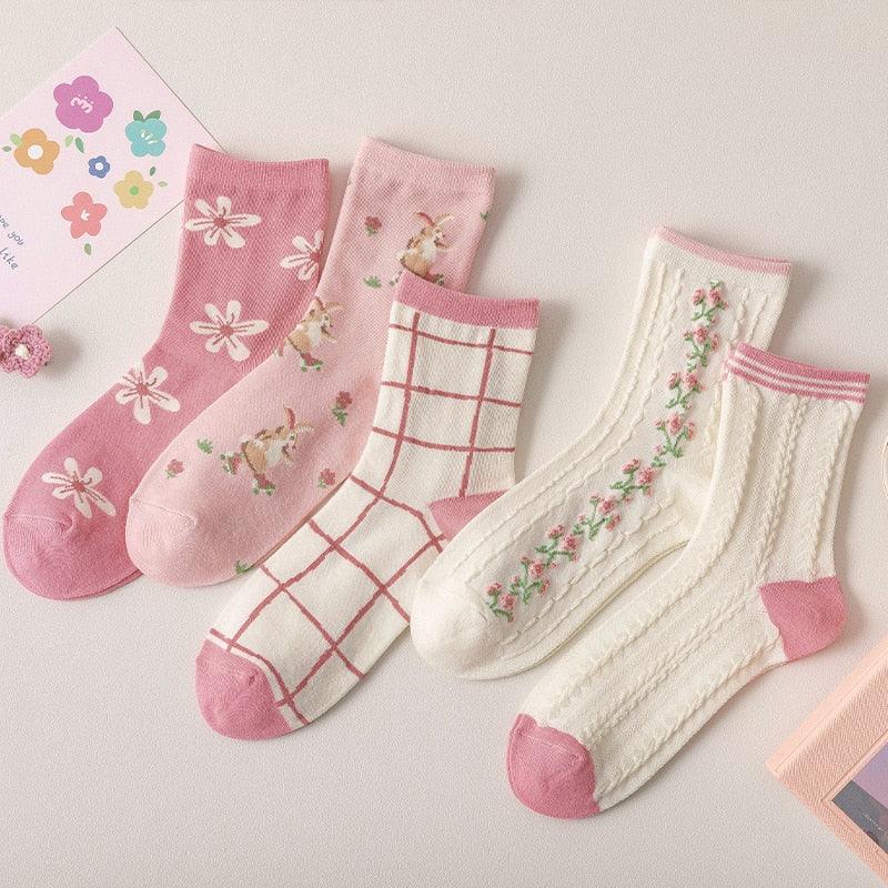 Assorted floral and plaid socks set with pink and cream pairs