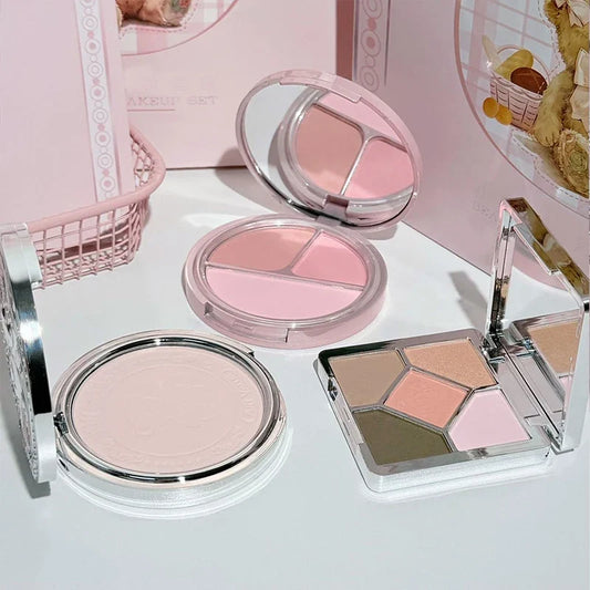 Set of four bear-themed face compacts with blush and eye shadow shades