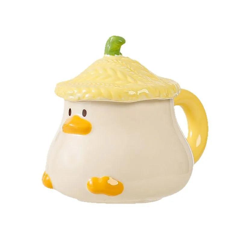 Duck-shaped ceramic mug with lid, cream body, green topper and orange beak detail