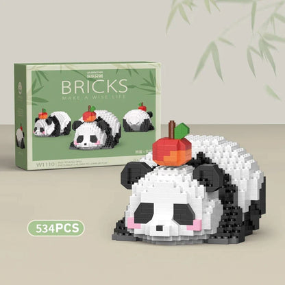 Panda building block figure with red fruit on head and green accents, black-and-white