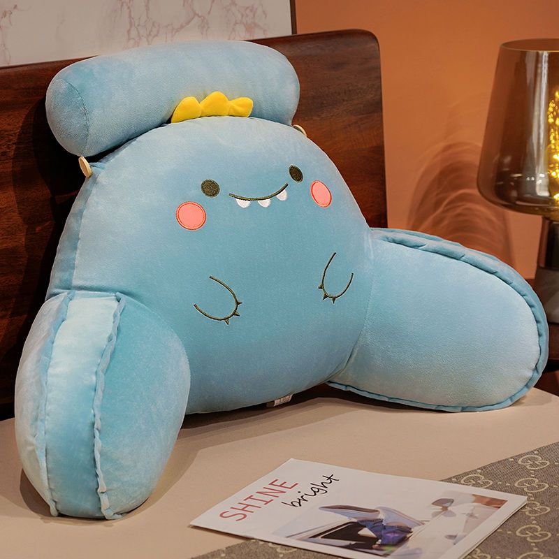 Light blue cute animal reading pillow with sleepy eyes and stitched winglike shapes