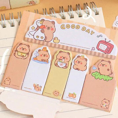 Capybara-themed sticky notes set with assorted pastel note bookmarks in a spiral pad