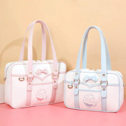 Pink-and-white kawaii messenger bag with bow front, star accents, and double handles