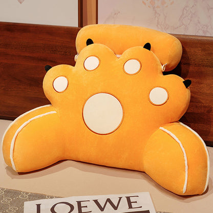 Orange cat-paw reading pillow with a large white face circle and yellow accents