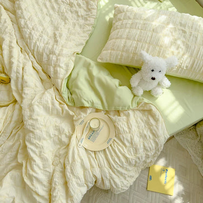 Yellow seersucker duvet cover close-up with crinkle texture and stitched trim
