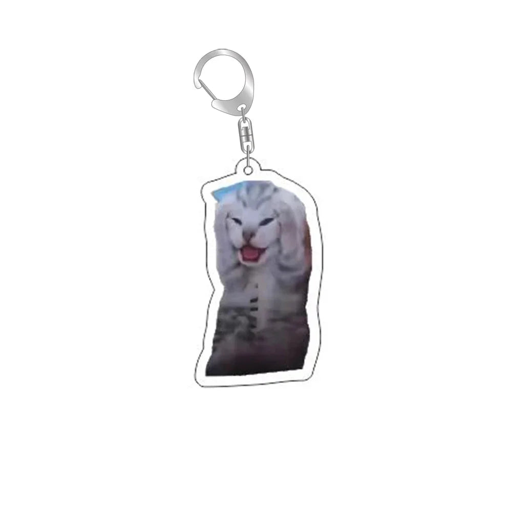 Funny cat face keychain with silver ring and clip; gray cat smiling with tongue out.