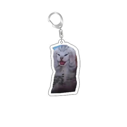 Funny cat face keychain with silver ring and clip; gray cat smiling with tongue out.