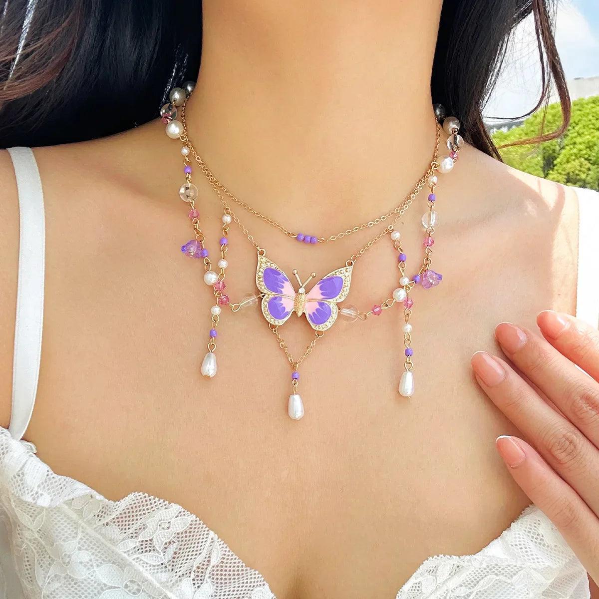 Butterfly imitation pearl multi-layer necklace with purple beads and teardrop charms