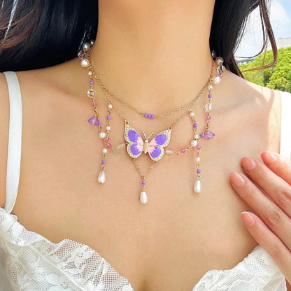 Butterfly imitation pearl multi-layer necklace with purple beads and teardrop charms