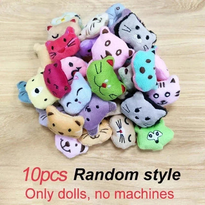 Assorted small animal plush dolls in a bundle on a light wooden surface