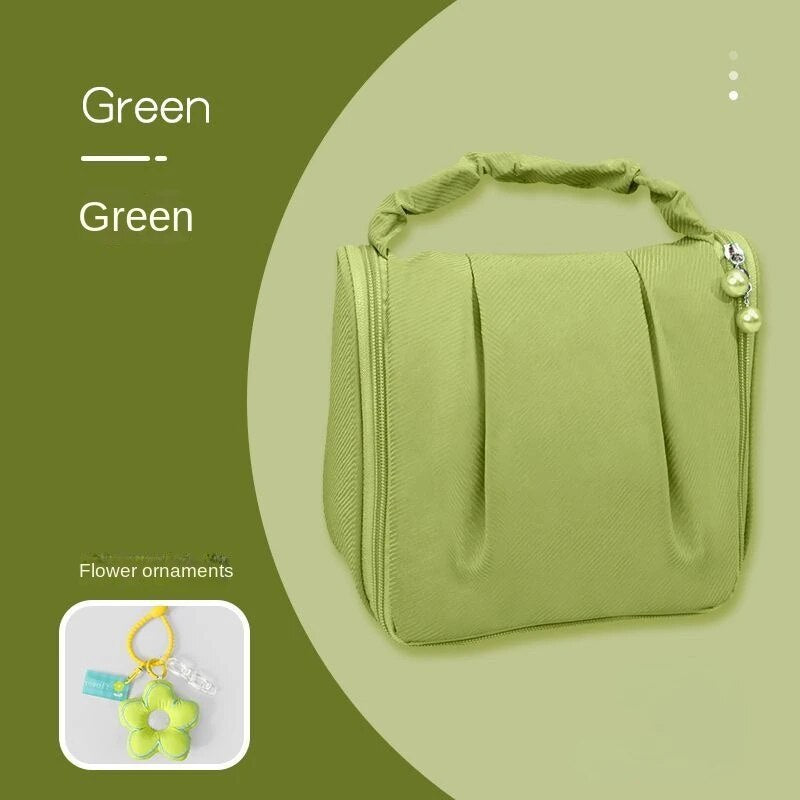 Green hanging makeup bag with flower ornament pendant and beaded side charm