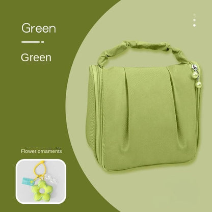Green hanging makeup bag with flower ornament pendant and beaded side charm