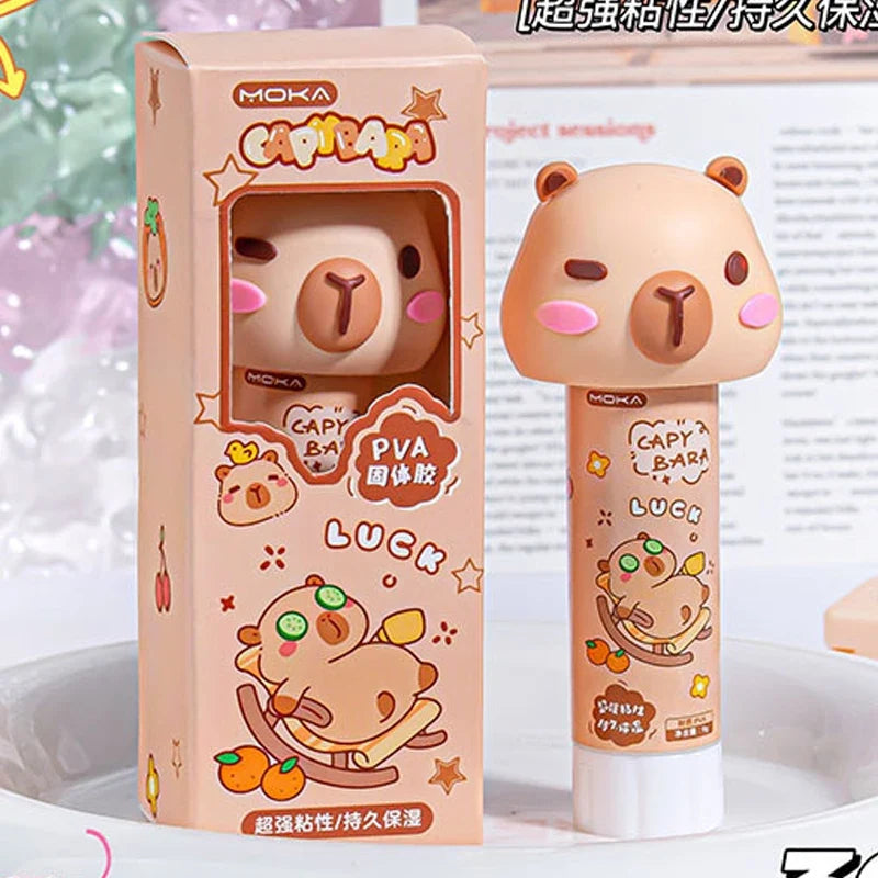 Capybara PVA glue stick box and tube featuring capybara character artwork
