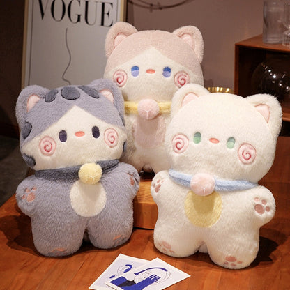 Three cat-shaped plush pillows in grey and cream with swirl faces and heart scarves
