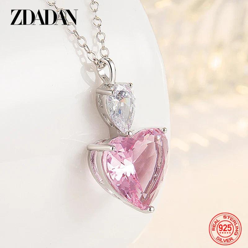 Sterling silver heart pendant necklace with pink and clear heart stones on chain
