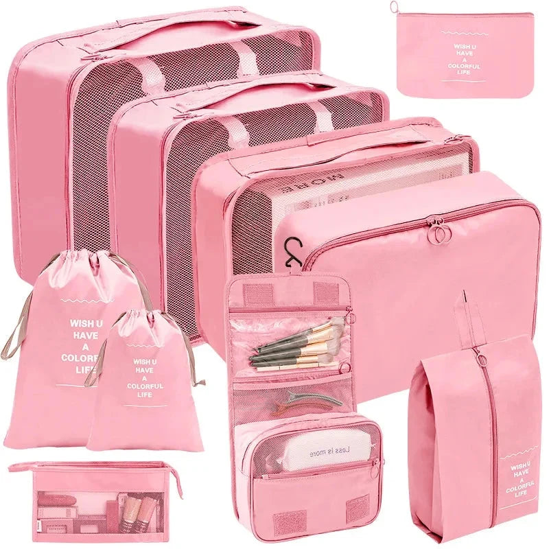 Pink packing cube set with gray mesh panels and zip pouches for organized travel