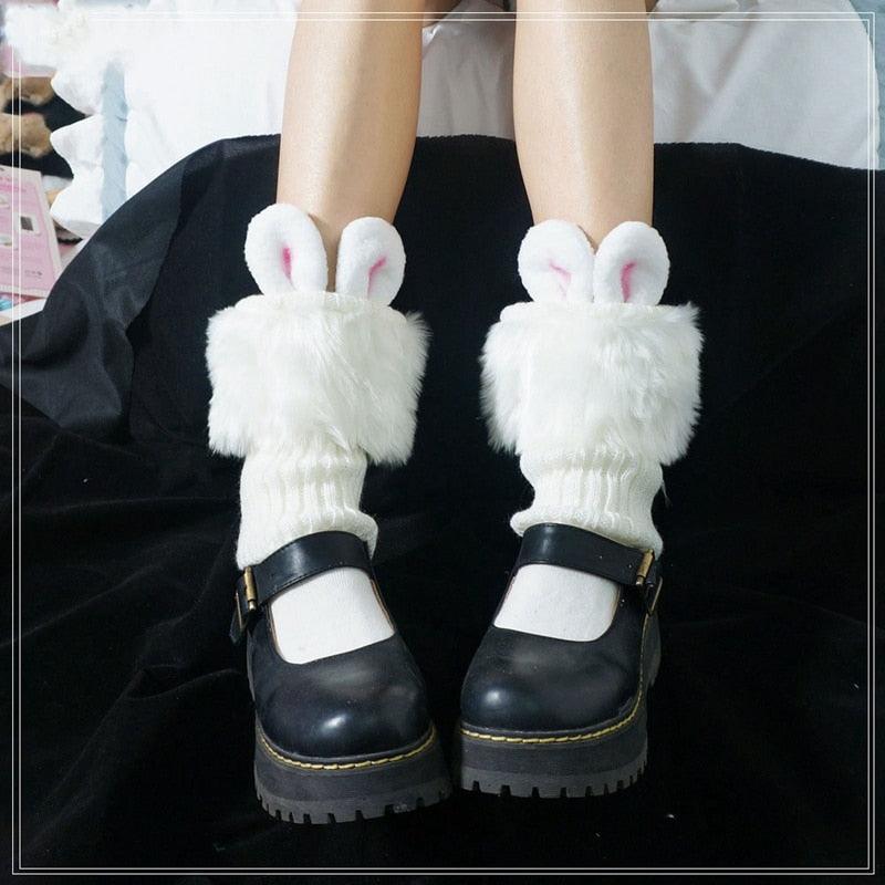 White plush rabbit ear socks with pink inner ears and fuzzy leg cuffs