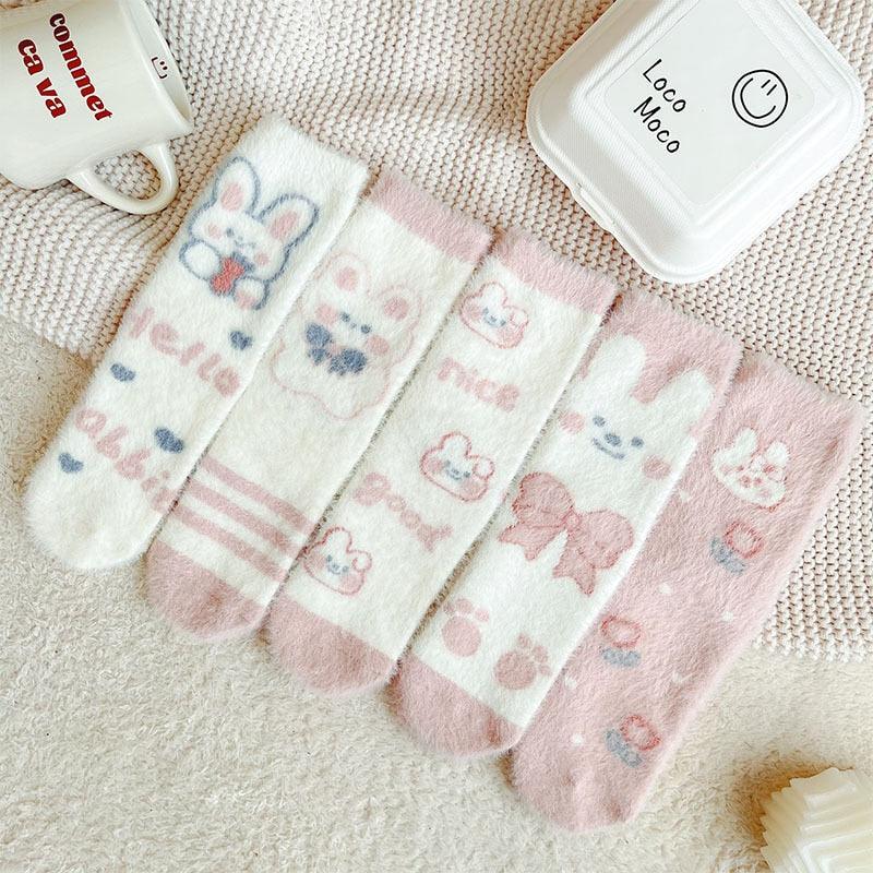 Bunny socks with multicolor pastel prints, including bunny faces, hearts, and small stripes.