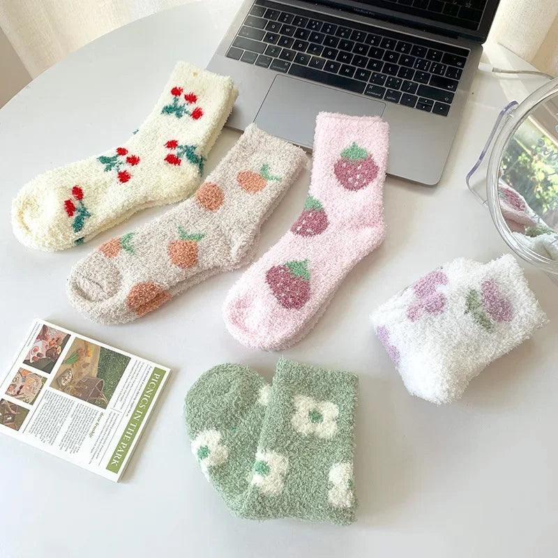 Soft plush sleeping socks with strawberry and carrot patterns, cream and pink tones