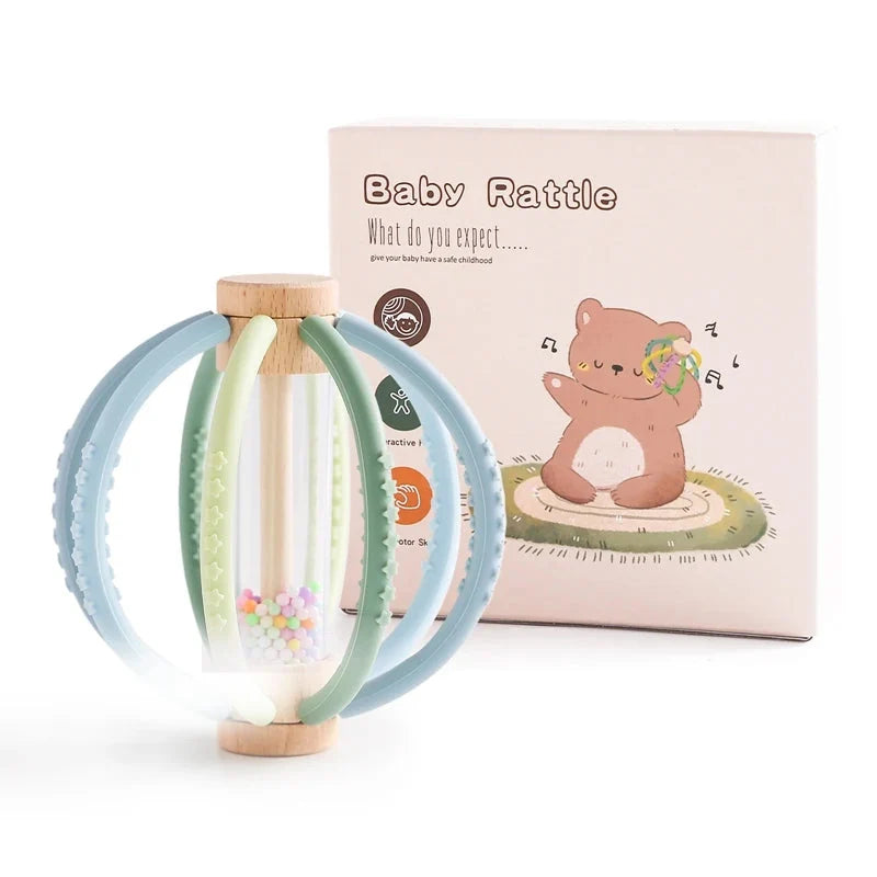 Baby rattle teether toy with light blue silicone rings and wood handle