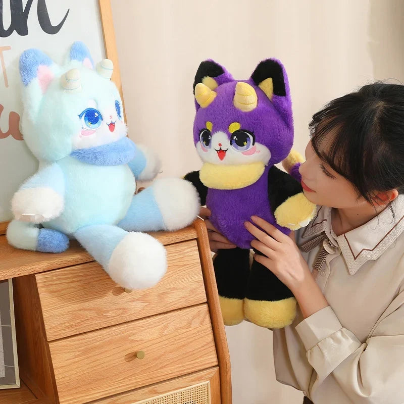 Light blue and purple dragon cat plush toys with cute faces and fluffy ears