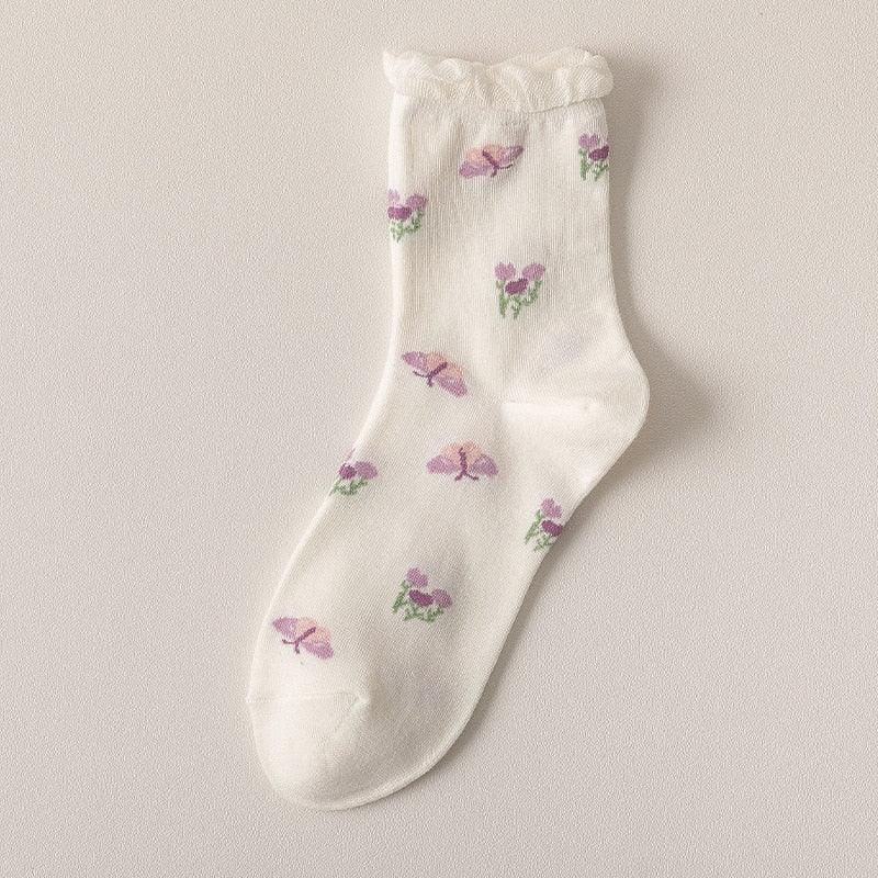 White floral socks with small purple and green flower prints