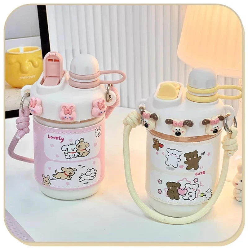 Pink and cream kids water bottles with straw lids and loop carry straps, animal prints