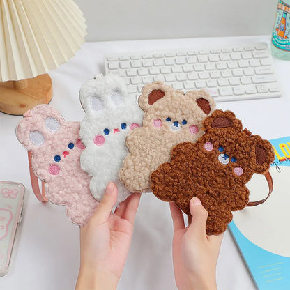 Plush animal photo card sleeves set in white, pink, beige, and brown, held in hands
