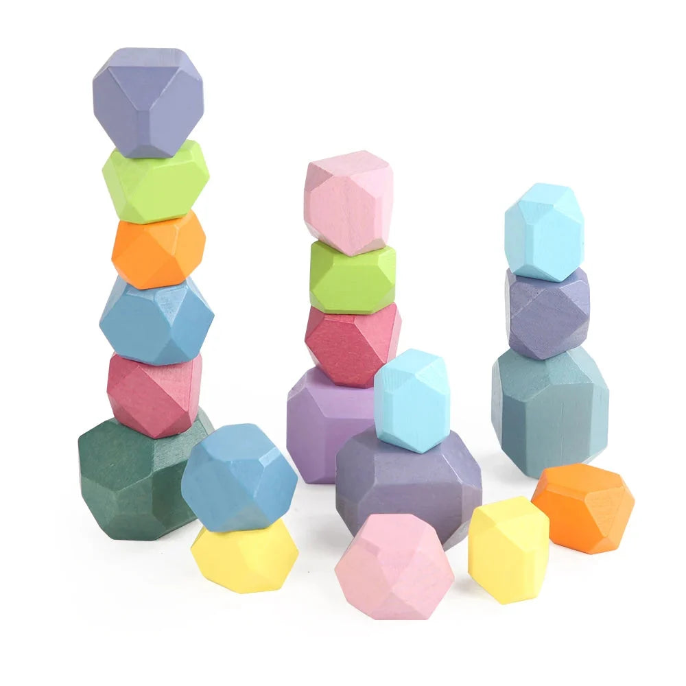 Pastel wooden stacking rocks set of faceted hexagon pieces in pink, blue, green, and orange