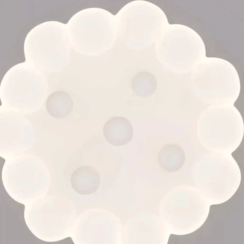 Close-up of a white cloud ceiling light diffuser with raindrop bulb dots