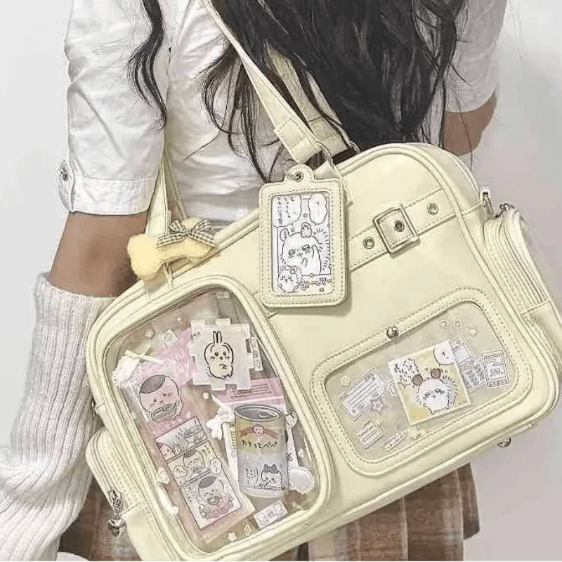 Pastel crossbody bag, light yellow/cream, front clear pocket and hanging ID charm