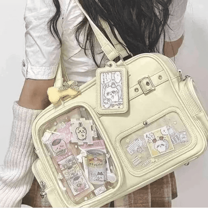 Pastel crossbody bag, light yellow/cream, front clear pocket and hanging ID charm