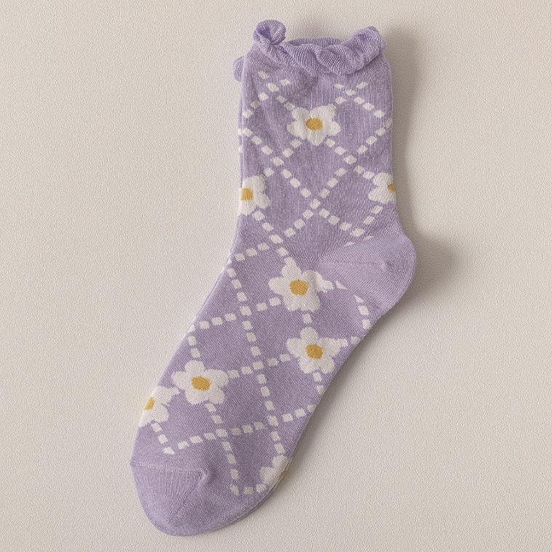 Lavender argyle socks with white dot pattern and yellow flower designs