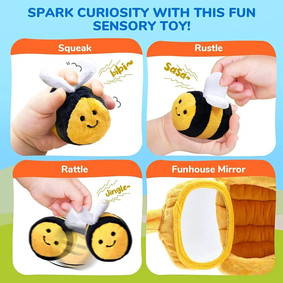 Plush bee toy with white wings and rattle elements, shown as squeak and rustle play