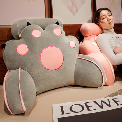 Gray cat-paw reading pillow with rounded paws and pink outlined face details